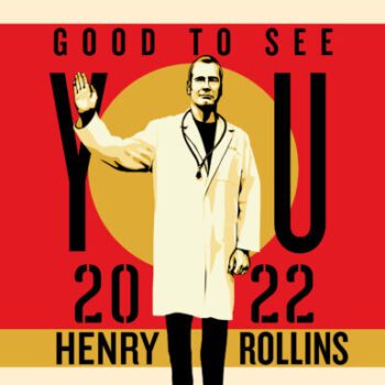 Henry Rollins in a lab coat waving