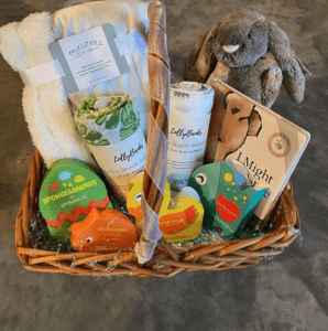 gift basket with baby toys towels and soaps