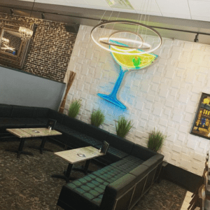 Lux interior with neon martini sign